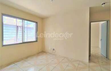 Imagem: O apartamento possui 1 Dormitório, 1 Banheiro, 1 Vaga na garagem