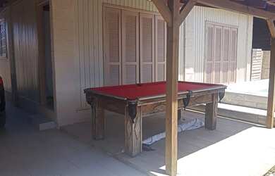 Imagem: A casa possui 5 Dormitórios, 2 Banheiros, 5 Vagas na garagem