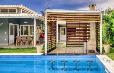 Imagem: A casa possui 3 Dormitórios, 3 Vagas na garagem e está localizado