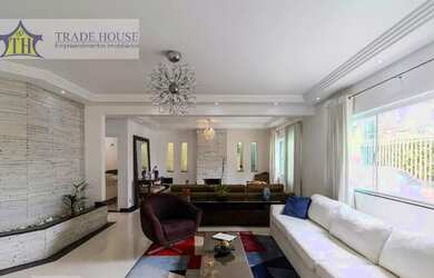 Imagem: A casa possui 4 Dormitórios, 5 Banheiros, 5 Vagas na garagem