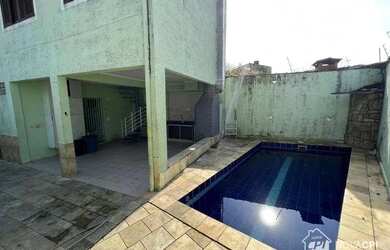 Imagem: A casa possui 5 Dormitórios, 5 Banheiros, 5 Vagas na garagem