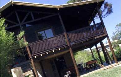 Imagem: A casa possui 3 Dormitórios, 3 Banheiros, 3 Vagas na garagem