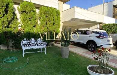 Imagem: A casa possui 4 Dormitórios, 5 Banheiros, 4 Vagas na garagem