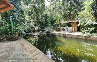 Imagem: A casa possui 5 Dormitórios, 5 Banheiros, 5 Vagas na garagem