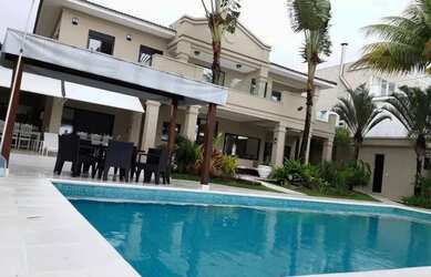 Imagem: A casa possui 5 Dormitórios, 5 Banheiros, 5 Vagas na garagem