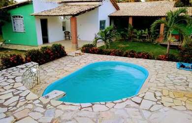 Imagem: A casa possui 5 Dormitórios e 5 Vagas na garagem e está localizado