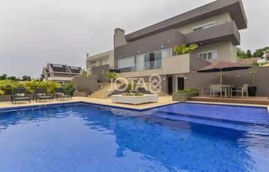 Imagem: A casa em condomínio possui 4 Dormitórios, 5 Banheiros, 5