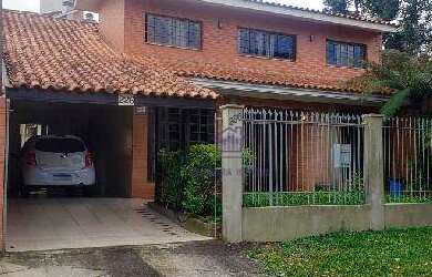 Imagem: A casa possui 3 Dormitórios, 2 Banheiros, 2 Vagas na garagem