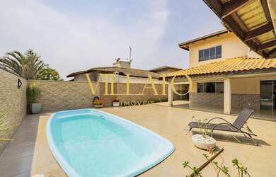 Imagem: A casa possui 3 Dormitórios, 4 Banheiros, 4 Vagas na garagem