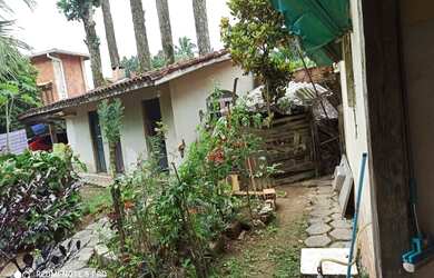 Imagem: A casa possui 3 Dormitórios, 2 Banheiros, 4 Vagas na garagem