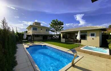 Imagem: A casa possui 4 Dormitórios, 5 Banheiros, 4 Vagas na garagem