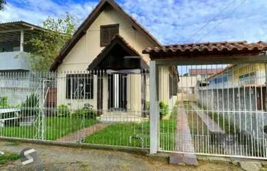 Imagem: A casa possui 5 Dormitórios, 3 Banheiros, 3 Vagas na garagem