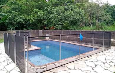 Imagem: A casa possui 3 Dormitórios, 4 Banheiros, 5 Vagas na garagem