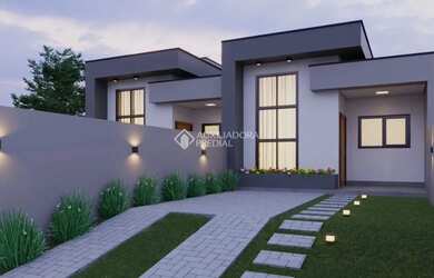 Imagem: A casa possui 3 Dormitórios, 2 Banheiros, 2 Vagas na garagem