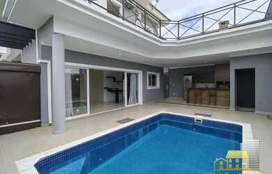 Imagem: A casa em condomínio possui 4 Dormitórios, 5 Banheiros, 4