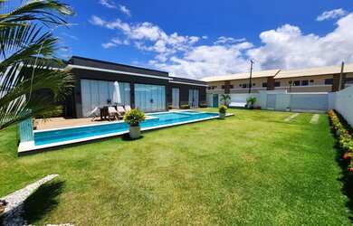 Imagem: A casa possui 3 Dormitórios, 3 Banheiros, 5 Vagas na garagem