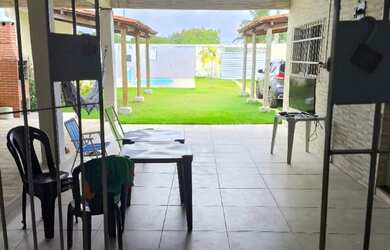 Imagem: A casa possui 2 Dormitórios, Acomodam 25 pessoas, 3 Vagas na