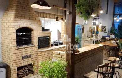 Imagem: A casa possui 3 Dormitórios, 5 Banheiros, 4 Vagas na garagem