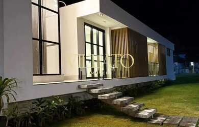 Imagem: A casa possui 3 Dormitórios, 4 Banheiros, 5 Vagas na garagem