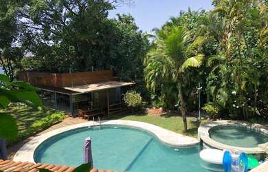 Imagem: A casa em condomínio possui 5 Dormitórios, 5 Banheiros, 5