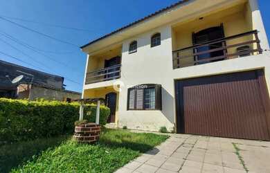 Imagem: A casa possui 4 Dormitórios, 2 Banheiros, 2 Vagas na garagem