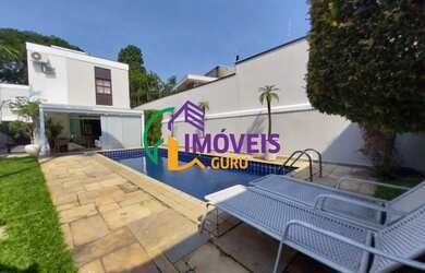 Imagem: A casa possui 4 Dormitórios, 5 Banheiros, 4 Vagas na garagem