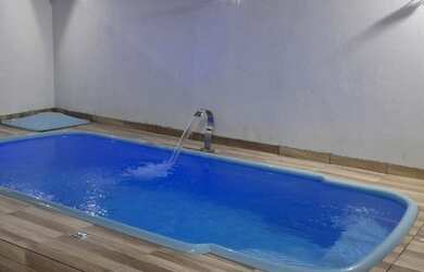 Imagem: A casa possui 3 Dormitórios e 1 Vaga na garagem e está localizado