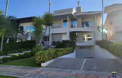 Imagem: A casa possui 5 Dormitórios, 5 Banheiros, 5 Vagas na garagem