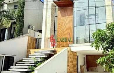 Imagem: A casa possui 4 Dormitórios, 5 Banheiros, 5 Vagas na garagem