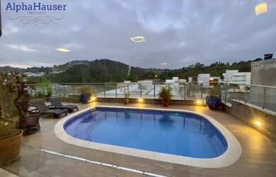 Imagem: A casa possui 4 Dormitórios, 5 Banheiros, 5 Vagas na garagem