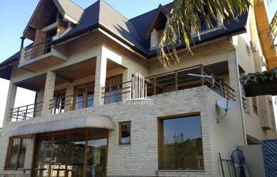 Imagem: A casa em condomínio possui 5 Dormitórios, 4 Banheiros, 5