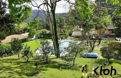 Imagem: A casa possui 4 Dormitórios, 5 Banheiros, 5 Vagas na garagem