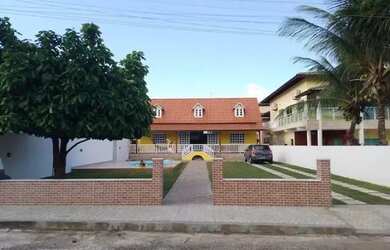 Imagem: A casa possui 2 Dormitórios, 3 Vagas na garagem e está localizado