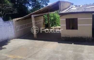 Imagem: A casa possui 2 Dormitórios, 1 Banheiro, 2 Vagas na garagem