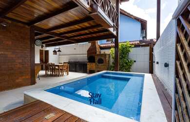 Imagem: A casa possui 4 Dormitórios, 2 Vagas na garagem e está localizado