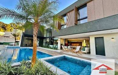 Imagem: A casa em condomínio possui 5 Dormitórios, 5 Banheiros, 5