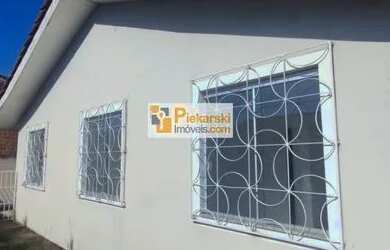 Imagem: A casa possui 3 Dormitórios, 1 Banheiro, 1 Vaga na garagem