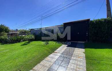 Imagem: A casa possui 2 Dormitórios, 1 Banheiro, 2 Vagas na garagem