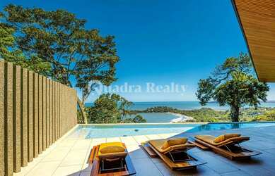 Imagem: A casa possui 4 Dormitórios, 5 Banheiros, 4 Vagas na garagem