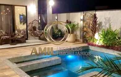 Imagem: A casa possui 3 Dormitórios, 5 Banheiros, 4 Vagas na garagem