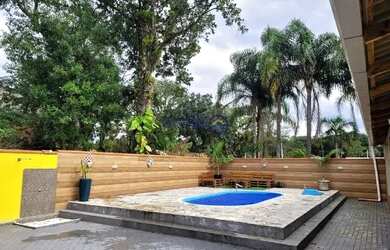 Imagem: A casa possui 4 Dormitórios, 3 Vagas na garagem e está localizado