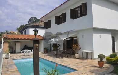 Imagem: A casa possui 4 Dormitórios, 5 Banheiros, 5 Vagas na garagem