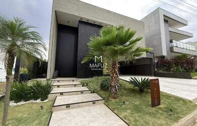 Imagem: A casa possui 3 Dormitórios, 5 Banheiros, 4 Vagas na garagem