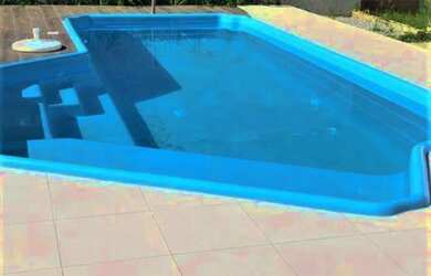 Imagem: A casa possui 3 Dormitórios, 2 Banheiros, 5 Vagas na garagem