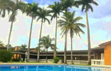 Imagem: A casa em condomínio possui 5 Dormitórios, 5 Banheiros, 5