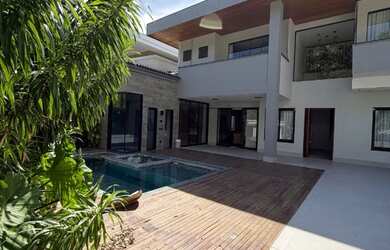 Imagem: A casa em condomínio possui 5 Dormitórios, 5 Banheiros, 3