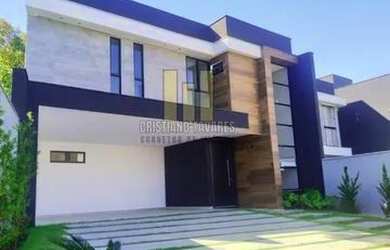 Imagem: A casa possui 3 Dormitórios, 2 Banheiros, 5 Vagas na garagem