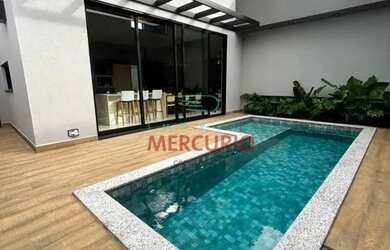 Imagem: A casa possui 3 Dormitórios, 4 Banheiros, 2 Vagas na garagem