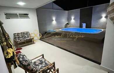 Imagem: A casa possui 3 Dormitórios, 3 Banheiros, 2 Vagas na garagem