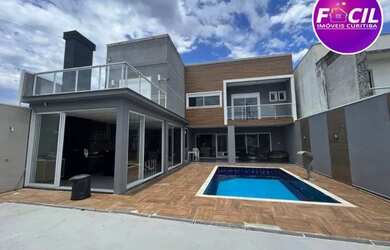 Imagem: A casa possui 5 Dormitórios, 5 Banheiros, 5 Vagas na garagem